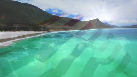 animation of flag of america waving over sunny sea and beach