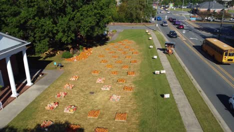 Forward-aerial-shot-of-church-pumpkin-patch-in