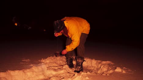 European-Man-Ice-Fishing-On-A-Winter-Night