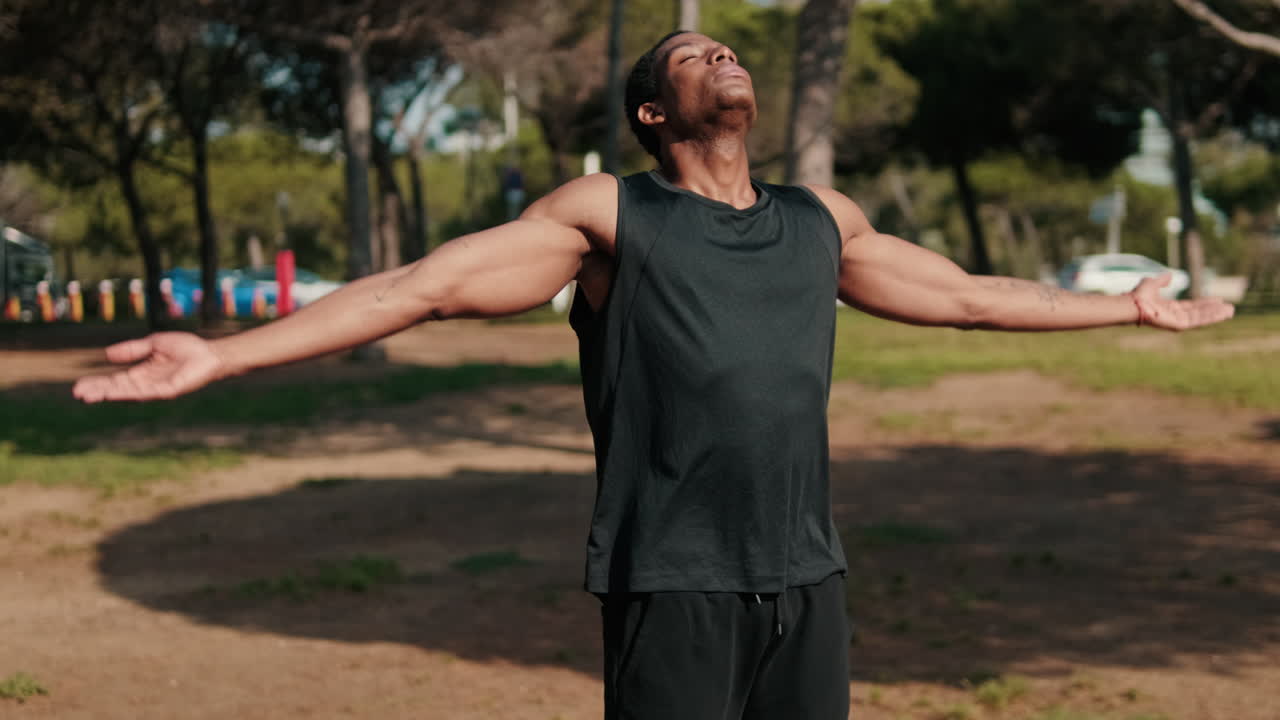 Young Athlete Breathing Deeply in Park
