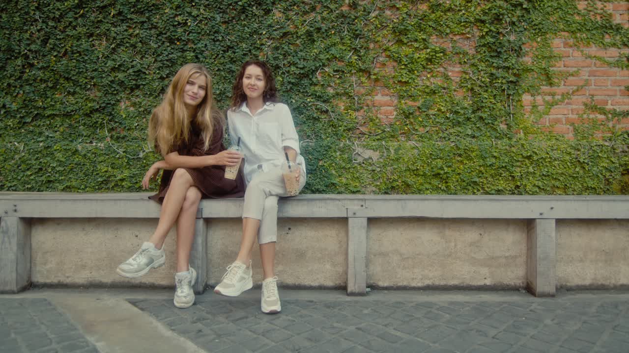 Two Friends Enjoying Bubble Tea