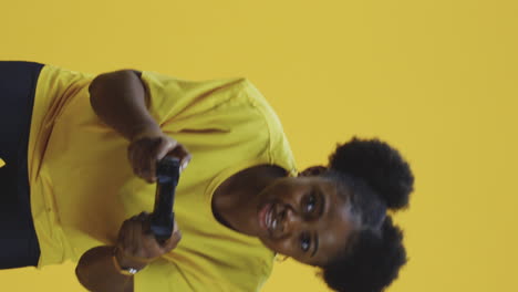 young woman playing video games with intense and focused expressions