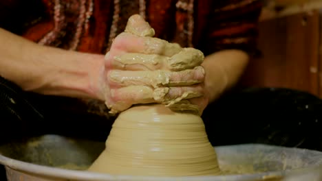 3 shots. professional male potter working with clay on potter's wheel