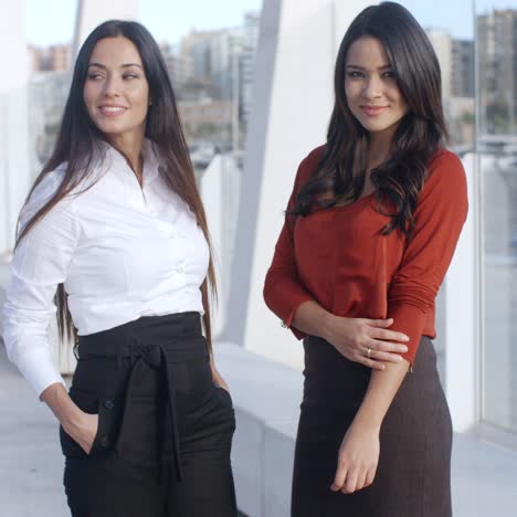 Two-Adorable-Women-Standing-at-Promenade