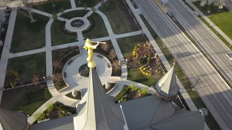 aerial drone shot of provo utah temple, cityscape and grounds