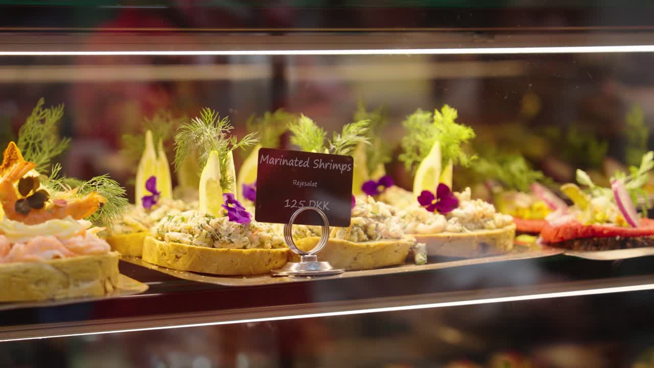Counter close up of marinated shrimp toast with lemon and dill topping, Denmark