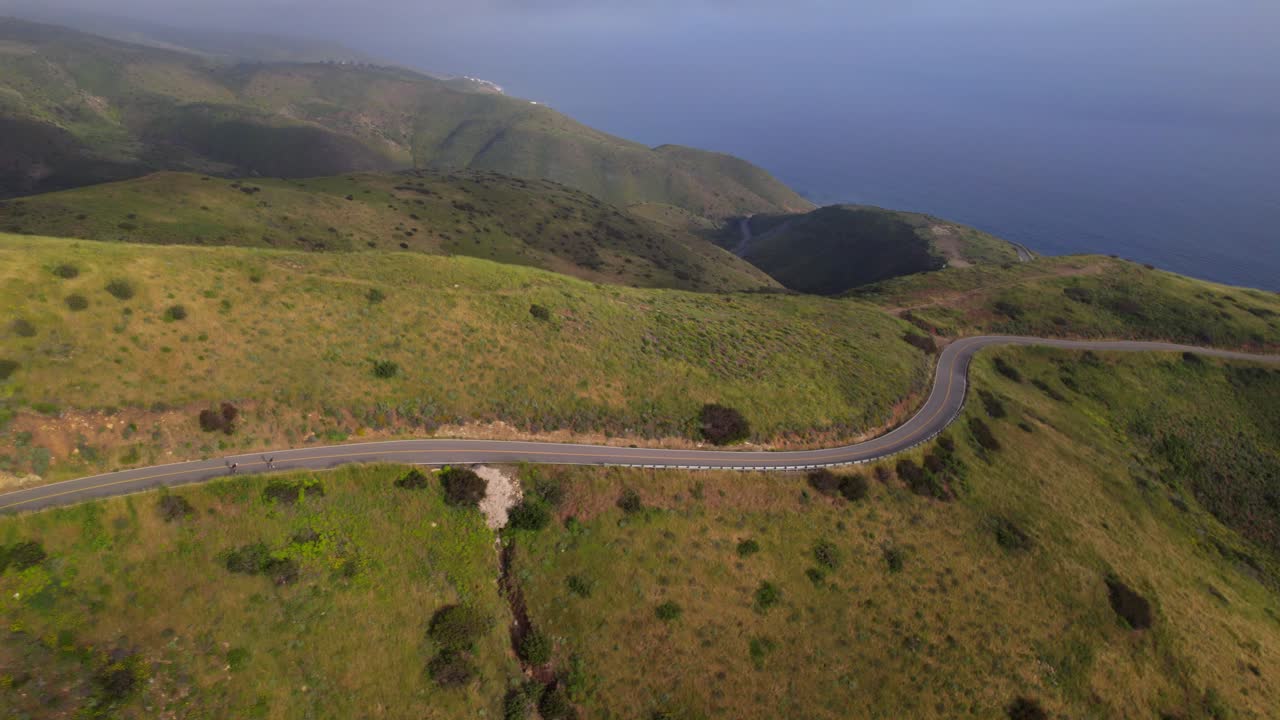 Longboarding down a road at high speed