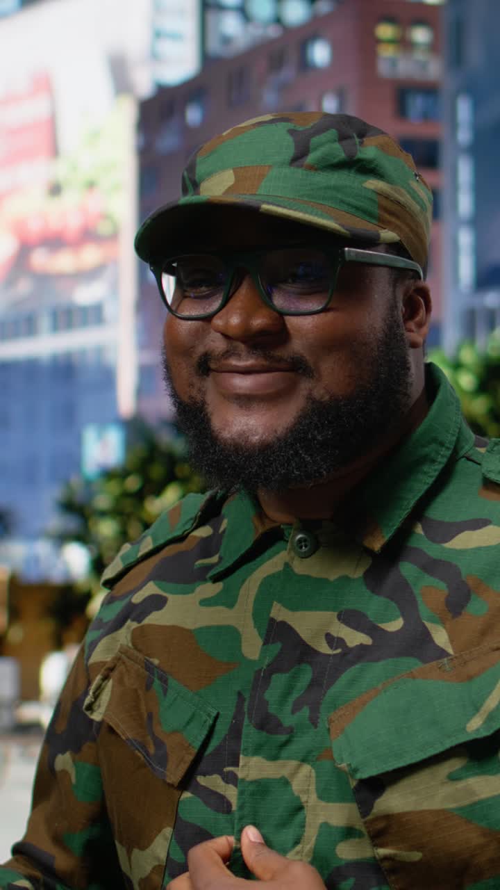 Vertical Video Military officer uses telephone call to give orders during patrol in city center