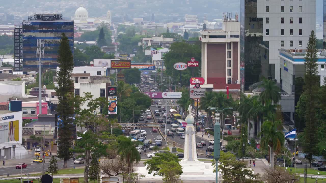Traffic in the downtown area of the city of San Salvador, El Salvador in front of the monument of The Divine Savior of The World.