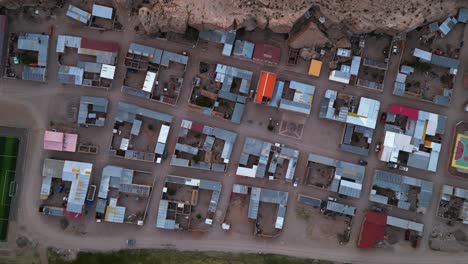 a colorful village in chile with structured layout at dusk, aerial view