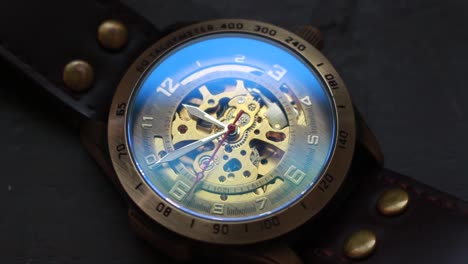 close up time lapse of a steampunk wrist watch