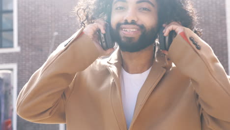 man with headphones enjoying the city