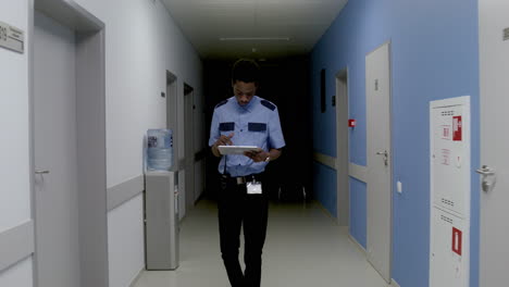 man in uniform working on the corridor