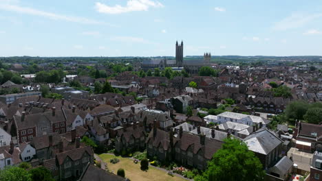 residential houses with canterbury cathedral in the distance in canterbury, england, uk. - aerial shot