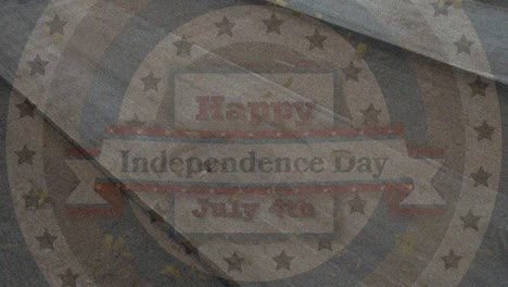 animation of happy independence day text over start and circular stripes of flag of america on wood