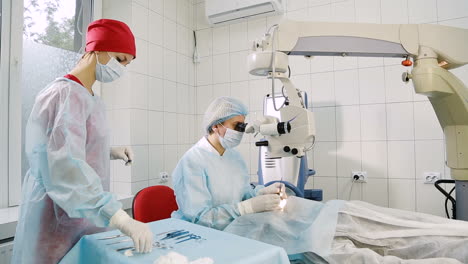laser vision correction. patient lies on the operating surgical table during ophthalmology operation surger