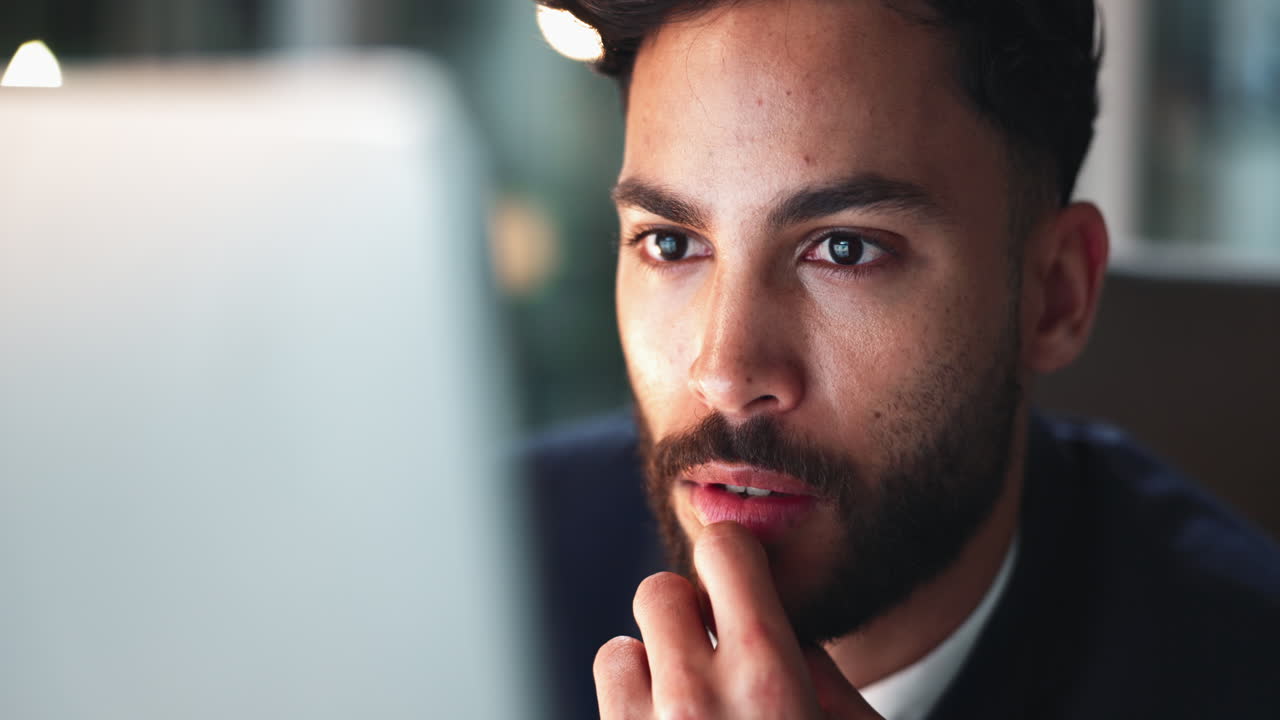 Man thinking in front of computer
