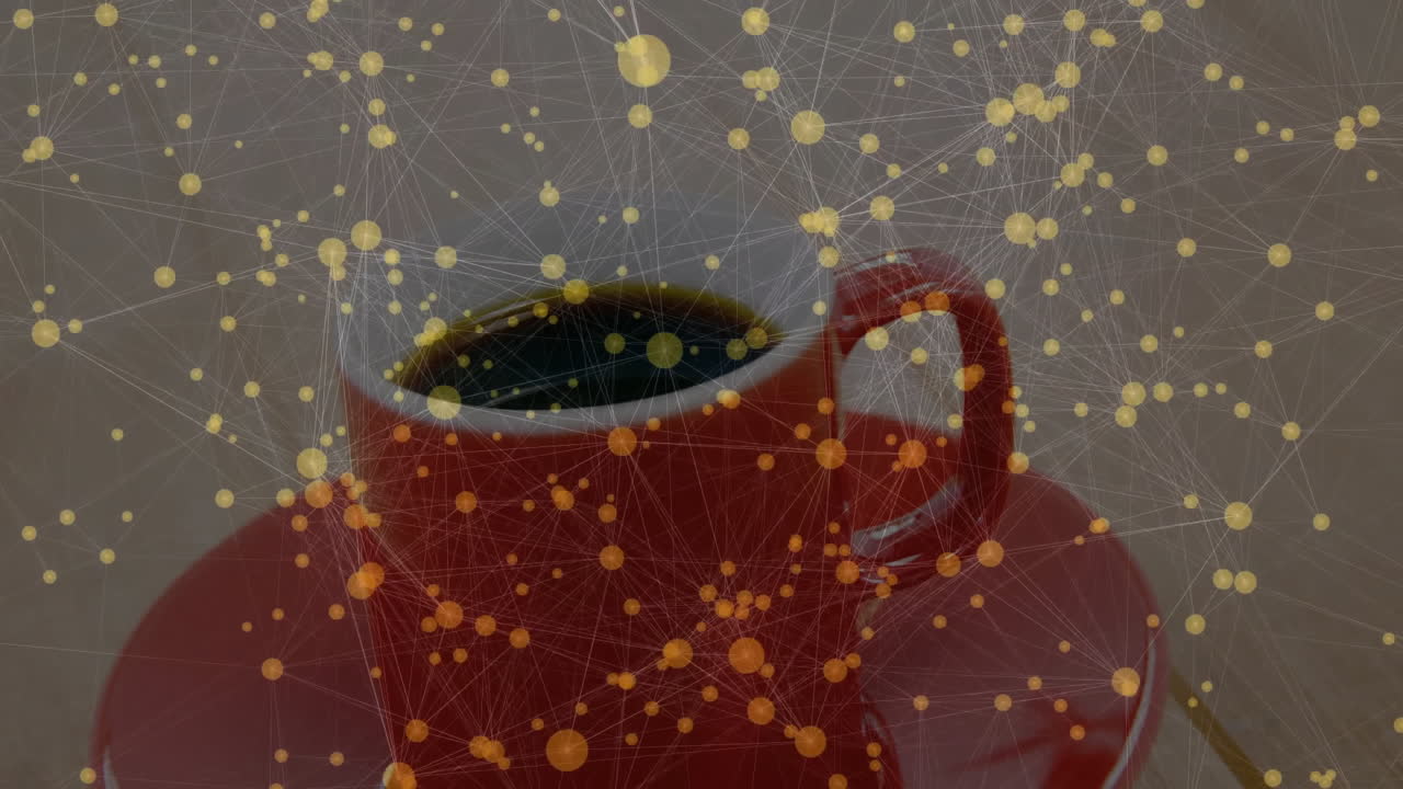 Red ceramic coffee cup sitting on matching saucer, showing digital network lines glowing around cup