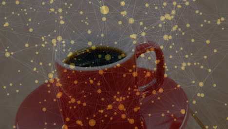 red ceramic coffee cup sitting on matching saucer, showing digital network lines glowing around cup