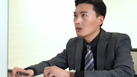 busy concentrated male financier working in office with excel spreadsheets and calculator. man in business suit working with documents and papers, mature successful investor reviewing reports.