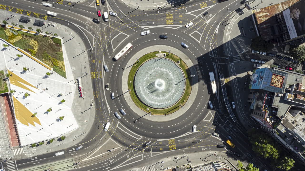 Aerial View of a Busy City Roundabout with Fountain
