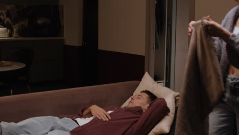 couple relaxing at home at night