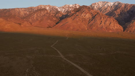 the snowy mountains of the sierra nevada during sunrise