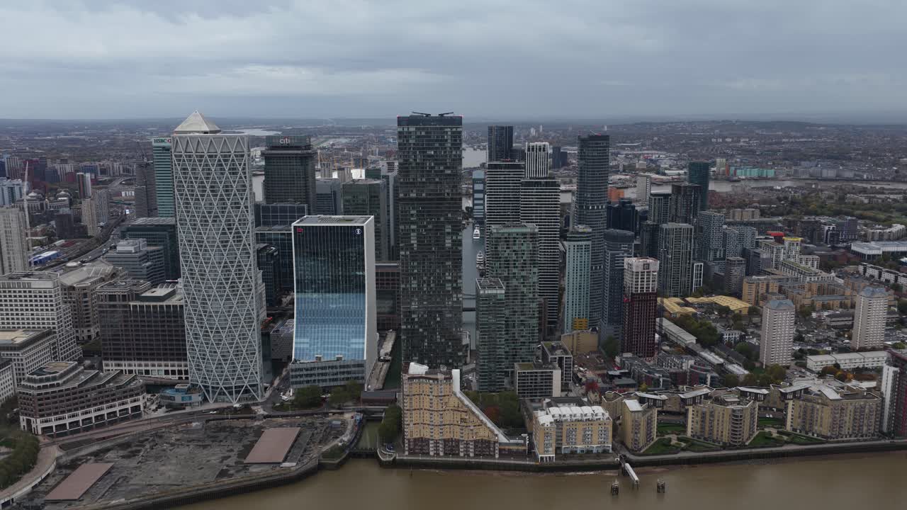Aerial drone view of Canary Wharf in London, showcasing its modern skyscrapers, multinational headquarters, financial institutions, and the iconic skyline of one of Europe’s major business districts
