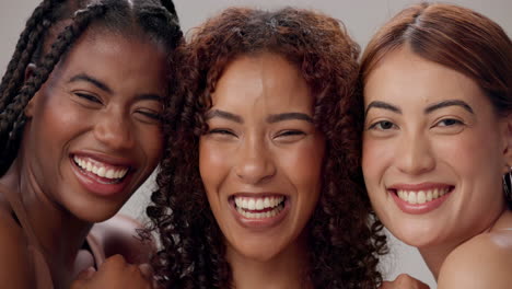 three smiling women friends