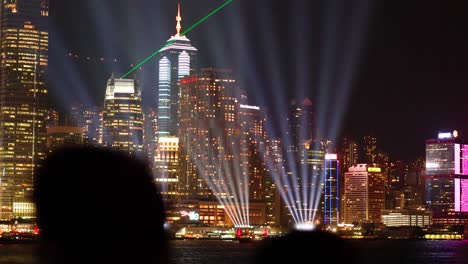 colorful light show over hong kong skyline