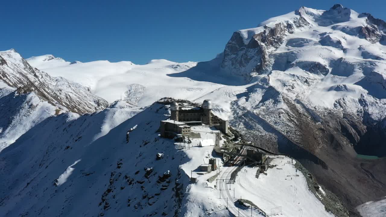 Mountain train station in Zermatt, Switzerland. Matterhorn. Aerial footage . Winter