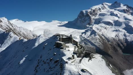 mountain train station in zermatt, switzerland. matterhorn. aerial footage . winter