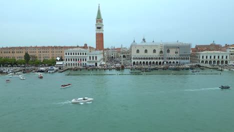 4K-Aerial-of-San-Marco,-the-Rialto-Bridge,-and-the-canals-in-Venice,-Italy-on-a-cloudy-day-7