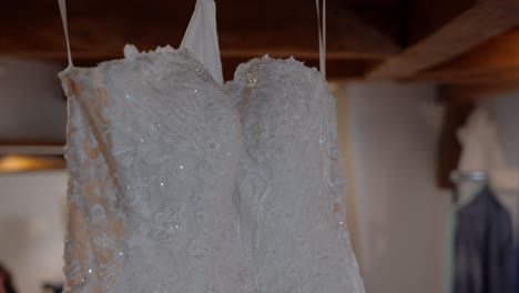 close-up of a beaded white lace wedding dress