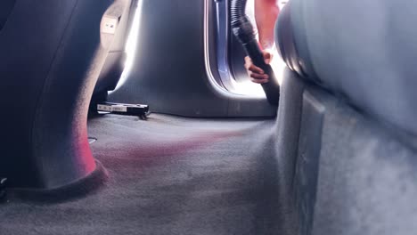 vacuuming a car interior