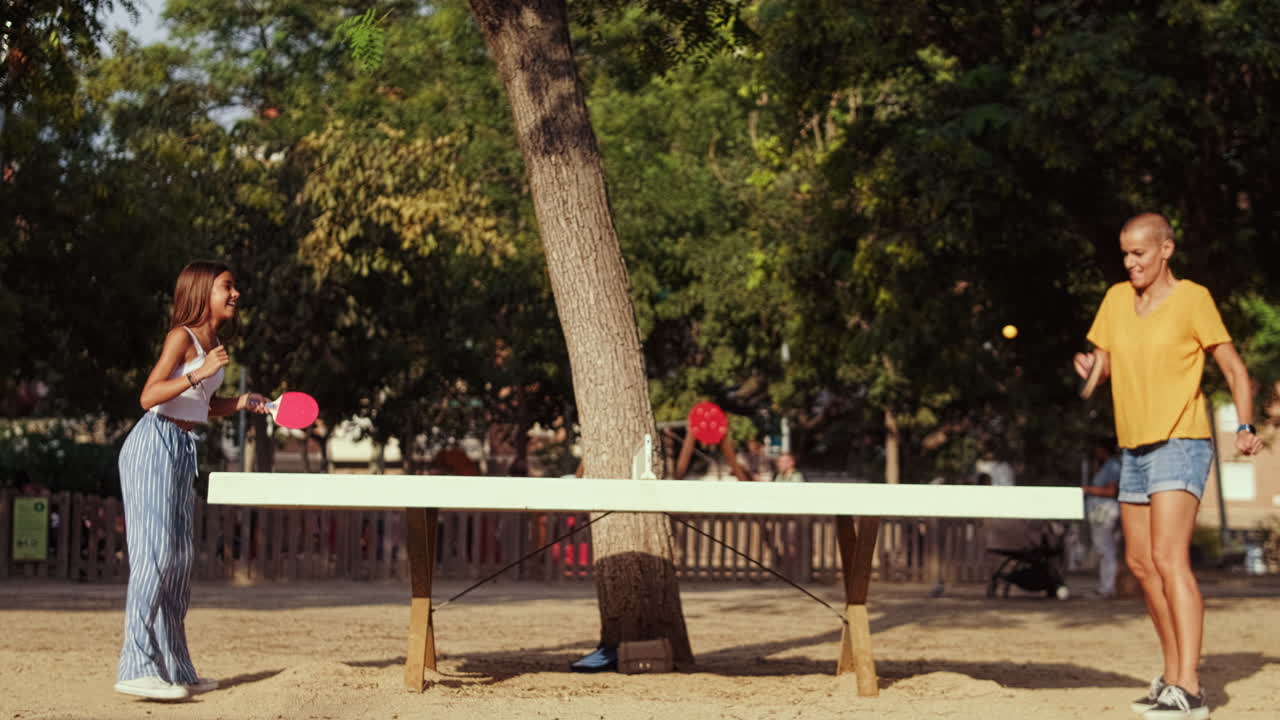 Woman playing table tennis in the park