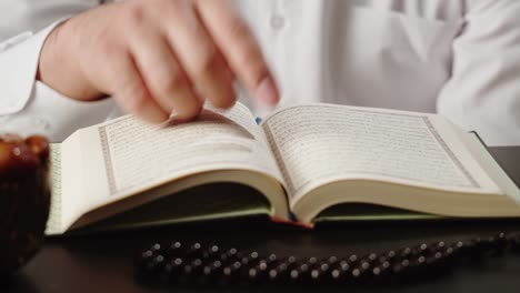 man reading the quran