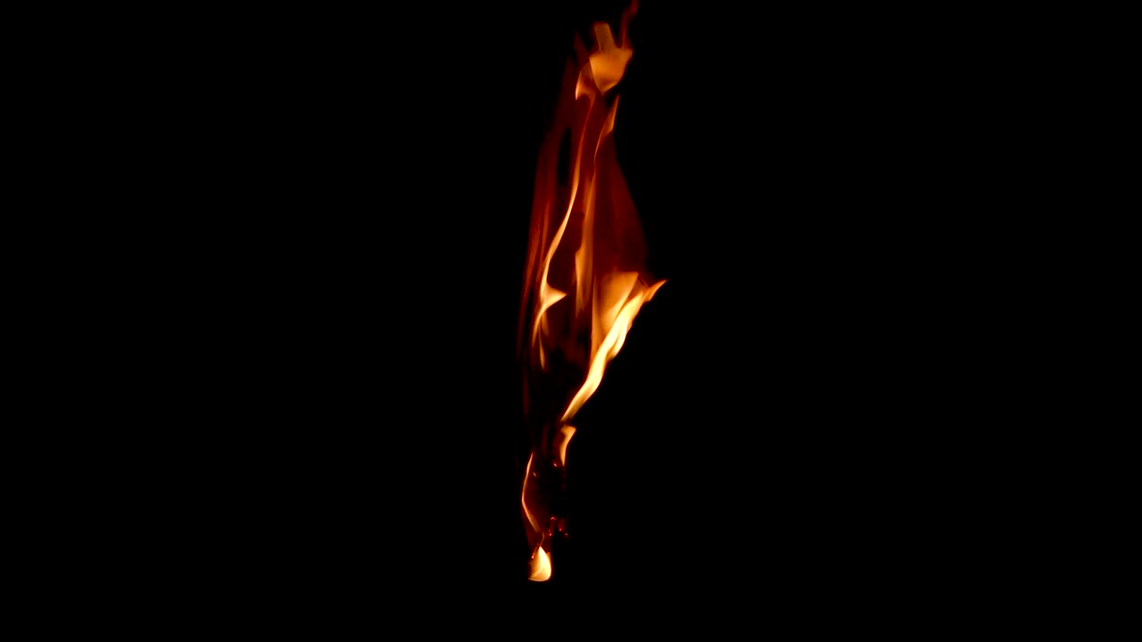 Burning a hanged paper isolated on dark background close up