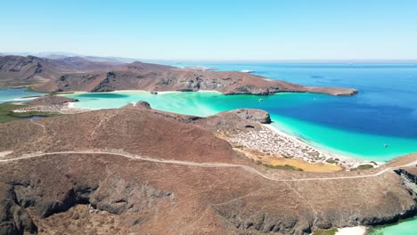 serene aerial view of tecolotito beach in la paz, mexico, showing clear turquoise waters
