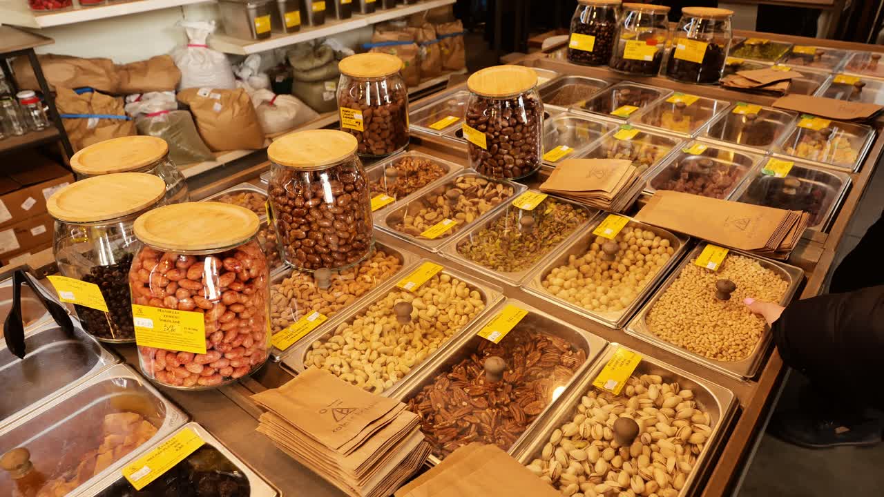 Eco-conscious refill store featuring wooden-lidded jars, plastic-free packaging