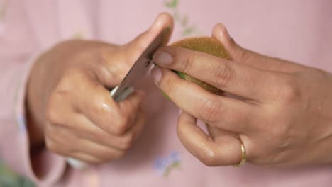 peeling a kiwi