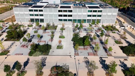 contemporary grey office building with front garden