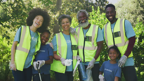 happy family cleaning a garden together