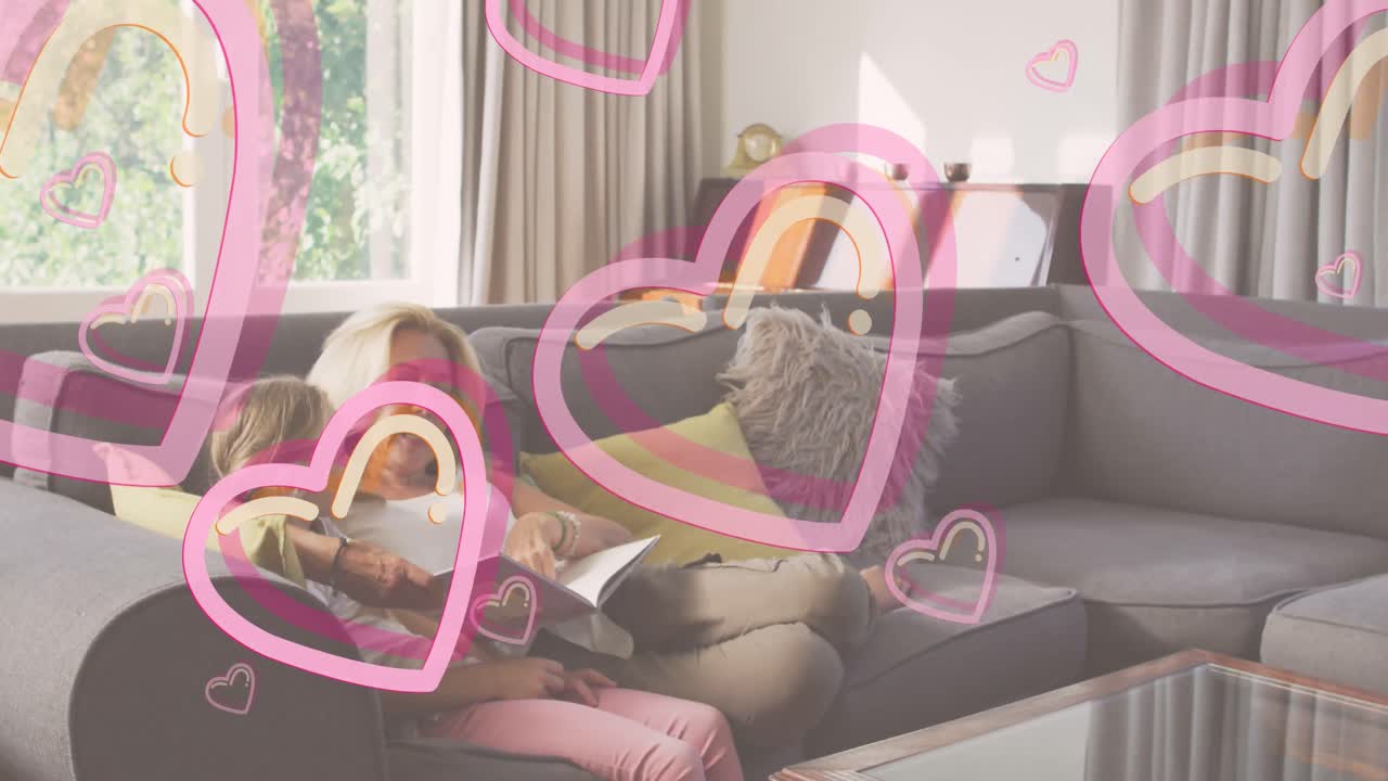 딸과 함께 읽는 백인 어머니 위에 심장 아이콘의 애니메이션