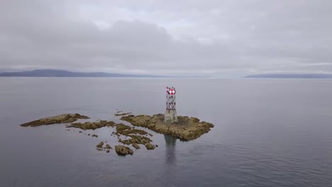 Slow-Aerial-Orbit-of-Vanderbilt-Reef-and-Navigation-Beacon,-Cloudy,-Juneau-AK,-Lynn-Canal