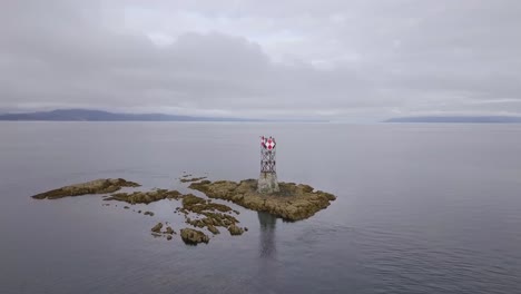 slow aerial orbit of vanderbilt reef and navigation beacon, cloudy, juneau ak, lynn canal