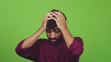 man cannot understand how something happened, putting arms on head, isolated on green screen