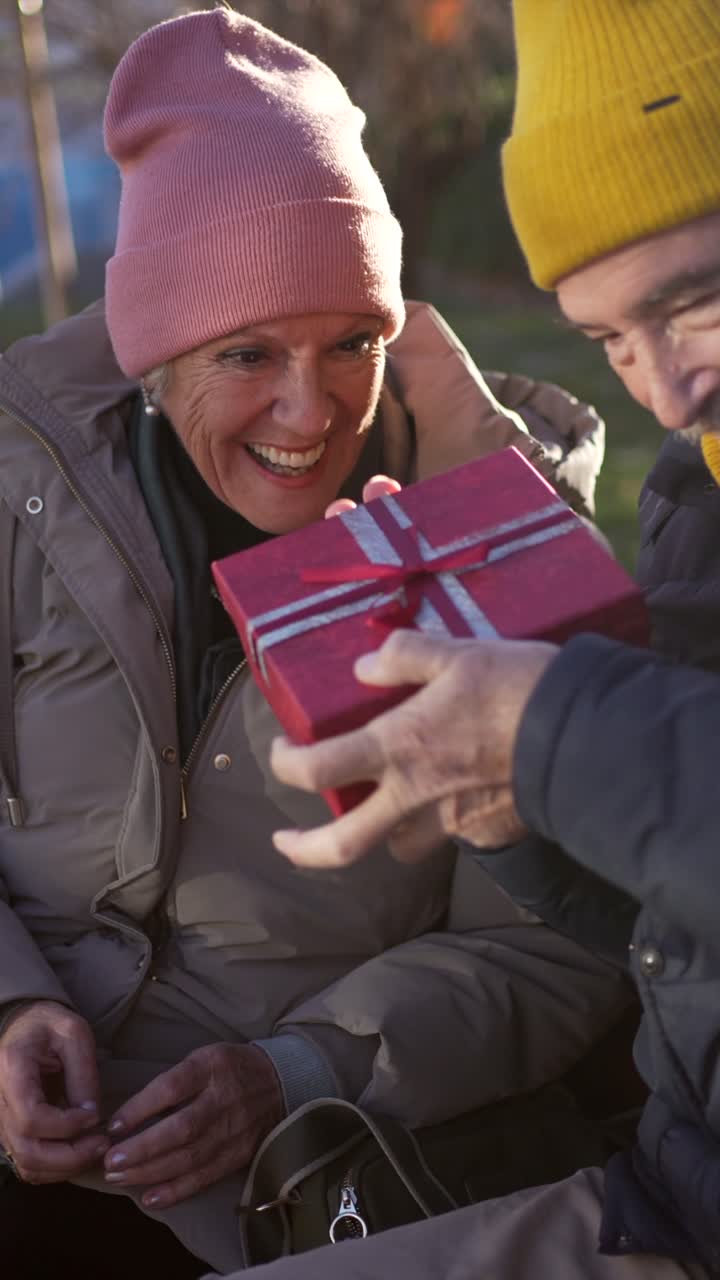 Senior Couple Exchanging a Gift