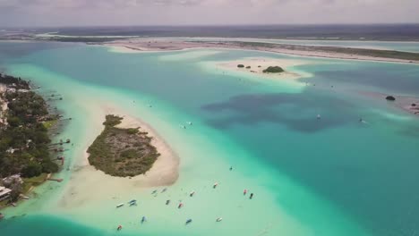 exotic travel destination lagoon of seven colors, bay and boats from above