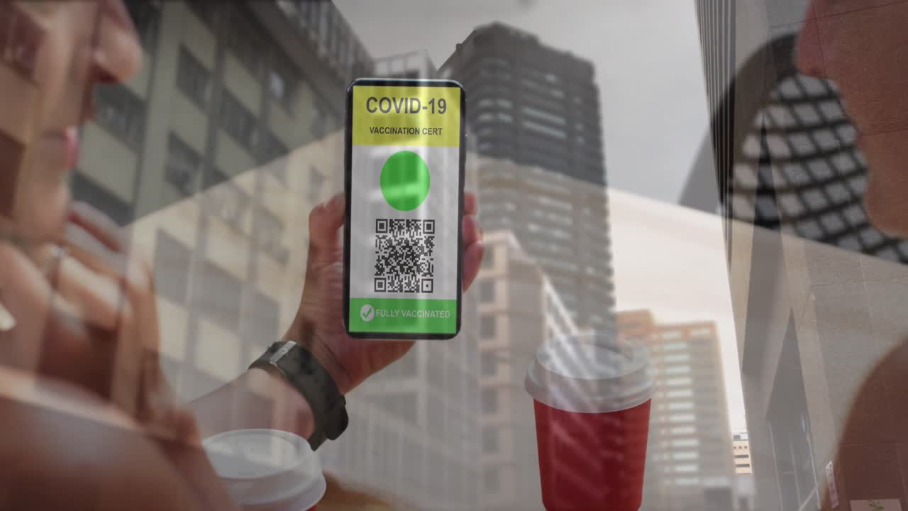 Animation of woman holding smartphone with covid 19 vaccination passport over cityscape